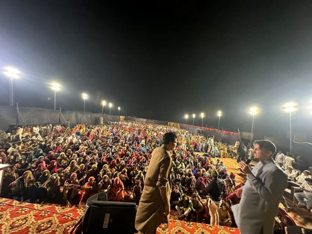 A crusade crowd at night in Pakistan